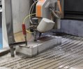 Cutting a bone-shaped steel fibre reinforced concrete specimen for tensile tests using a water jet cutting system